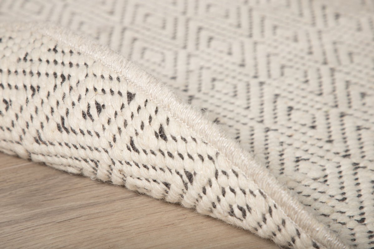 Vloerkleed Naveen – rond in Beige van polyester & katoen