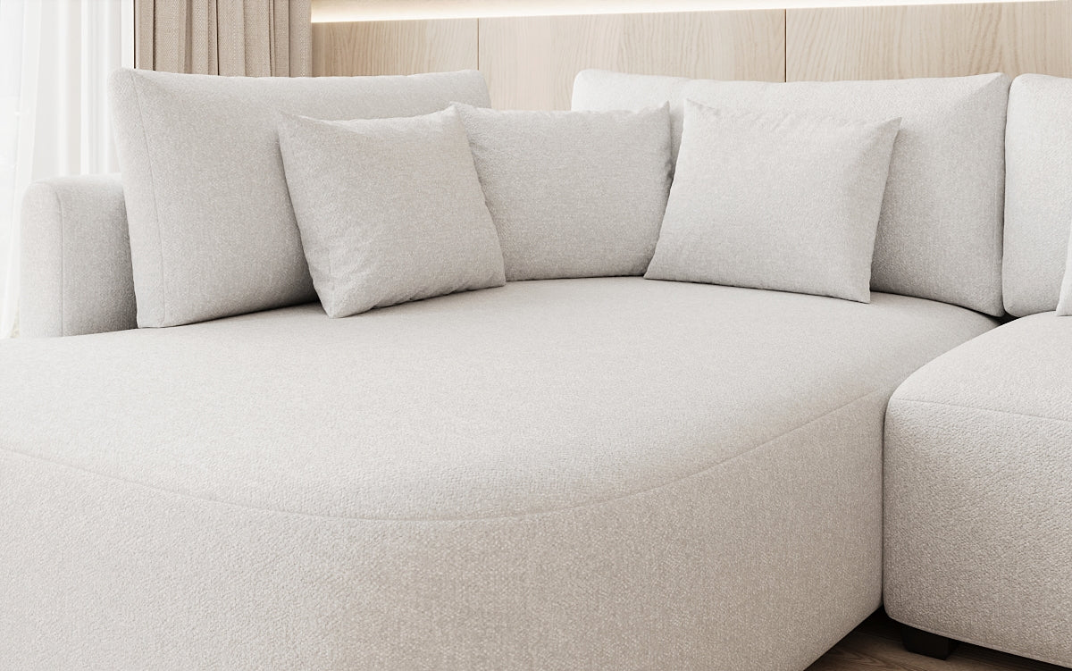 Designer hoekbank Ando met brede ottomane in structuurstof