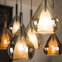 Hanglamp "Lumora - 7 druppelvormige glazen kappen in amber, koper en chroom