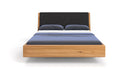 Designer houten bed Cassian van massief eiken in zwevende look