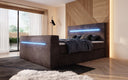 Boxspringbed Sejour met TV-lift, RGB en opbergruimte in Ribstof
