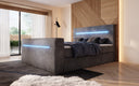 Boxspringbed Sejour met TV-lift, RGB en opbergruimte in Ribstof