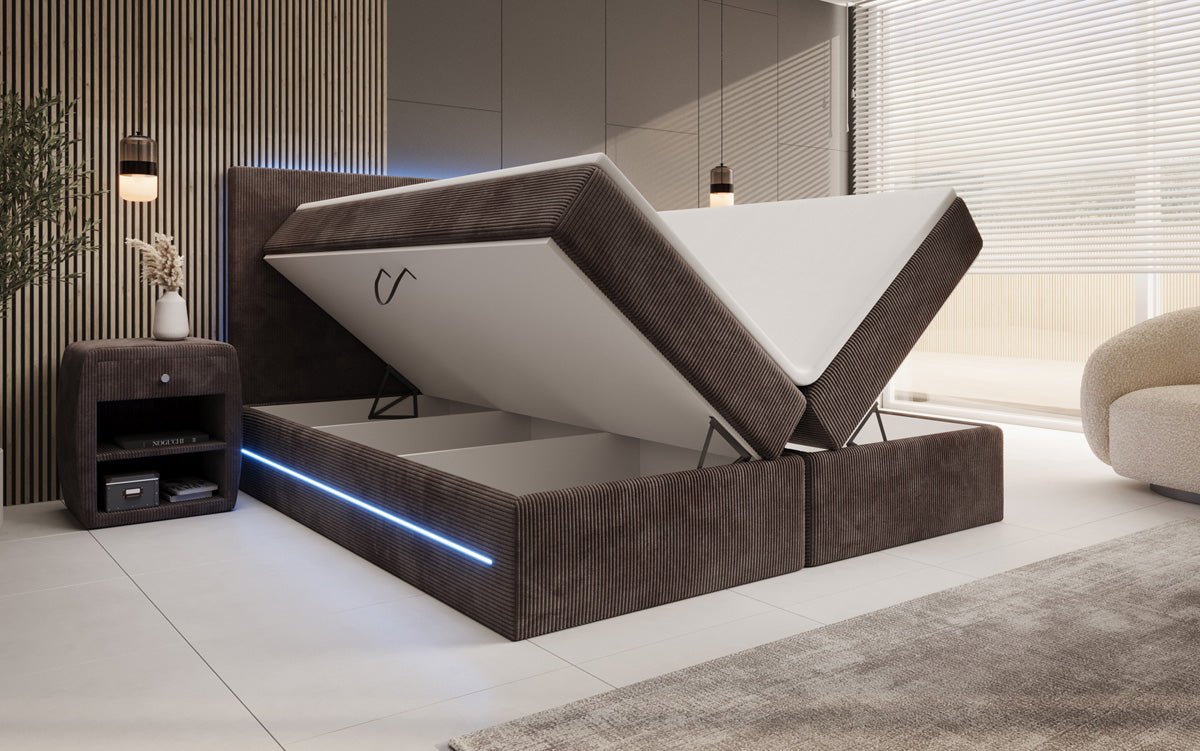 Boxspringbed Voyage met LED en opbergruimte in Ribstof