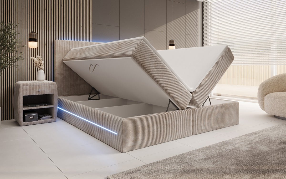 Boxspringbed Voyage met LED en opbergruimte in Ribstof