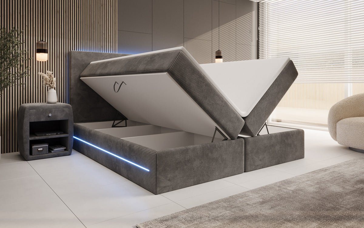 Boxspringbed Voyage met LED en opbergruimte in Ribstof