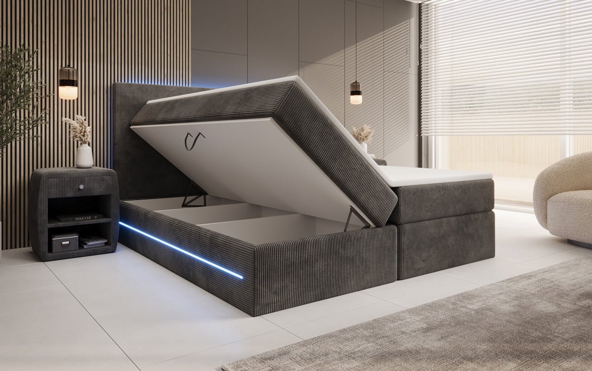 Boxspringbed Voyage met LED en opbergruimte in Ribstof