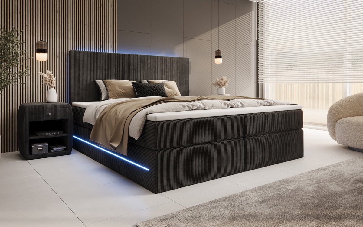 Boxspringbed Voyage met LED en opbergruimte in Ribstof