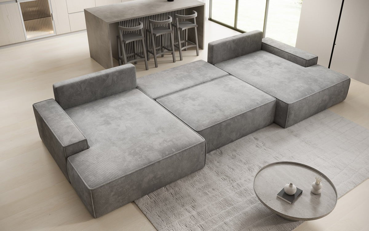 Designsofa Verona U met brede ottomane, slaapfunctie en opbergruimte in Ribstof