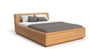 Designers houten bed Calveno van massief eiken met opbergruimte en schuin hoofdeinde