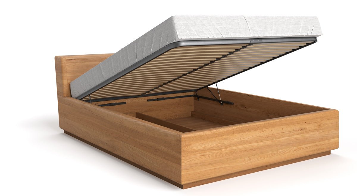 Designers houten bed Calveno van massief eiken met opbergruimte en schuin hoofdeinde